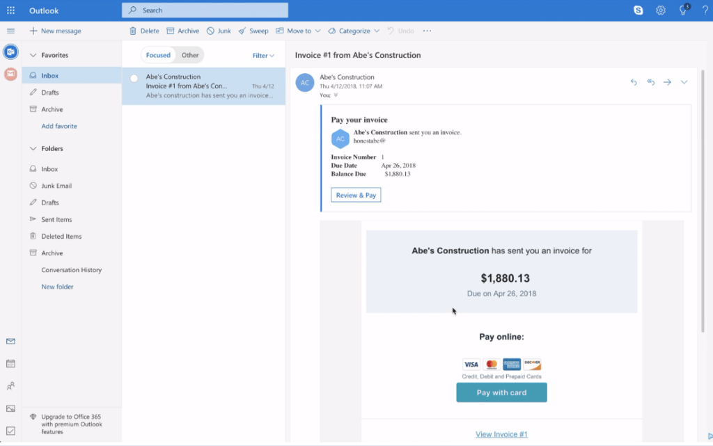 Image of an inbox with an invoice with the option to pay with credit card
